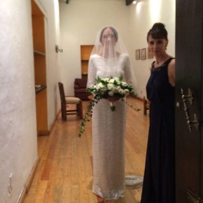 Megan Murphy Matheson is wearing a black dress whereas, Molly Matheson is on her wedding dress holding flowers.